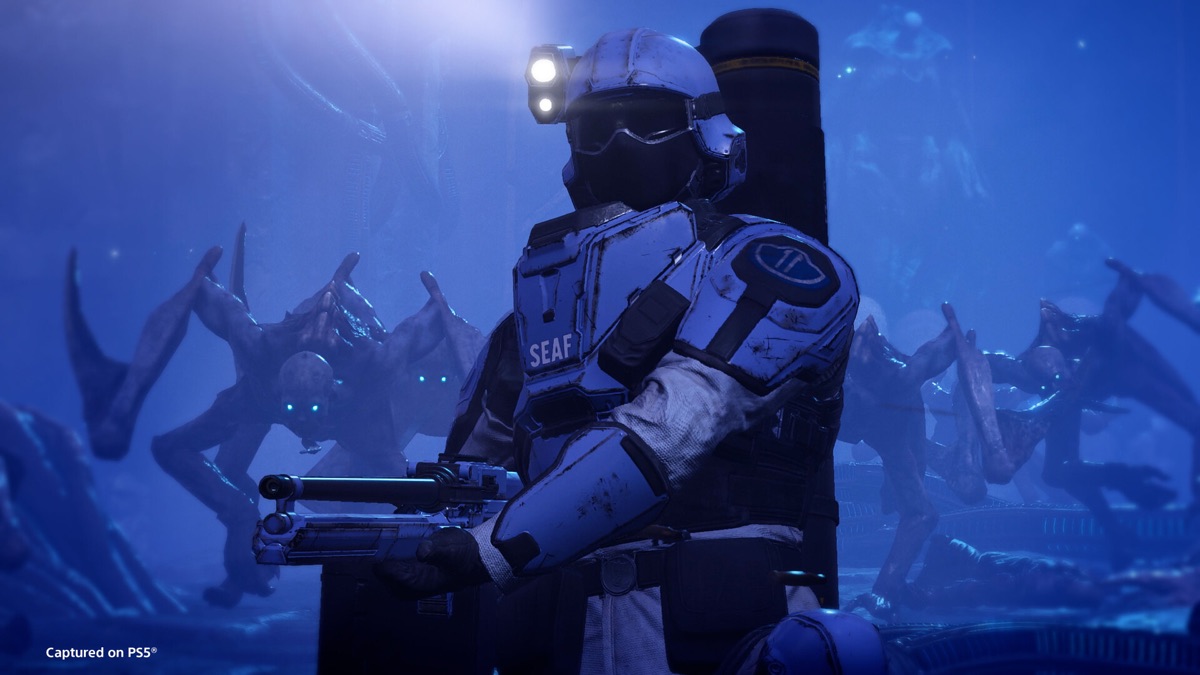 An armored Helldiver aims a heavy weapon.