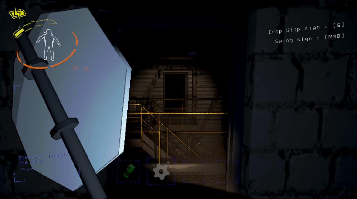 A scavenger searches a dark industrial corridor.