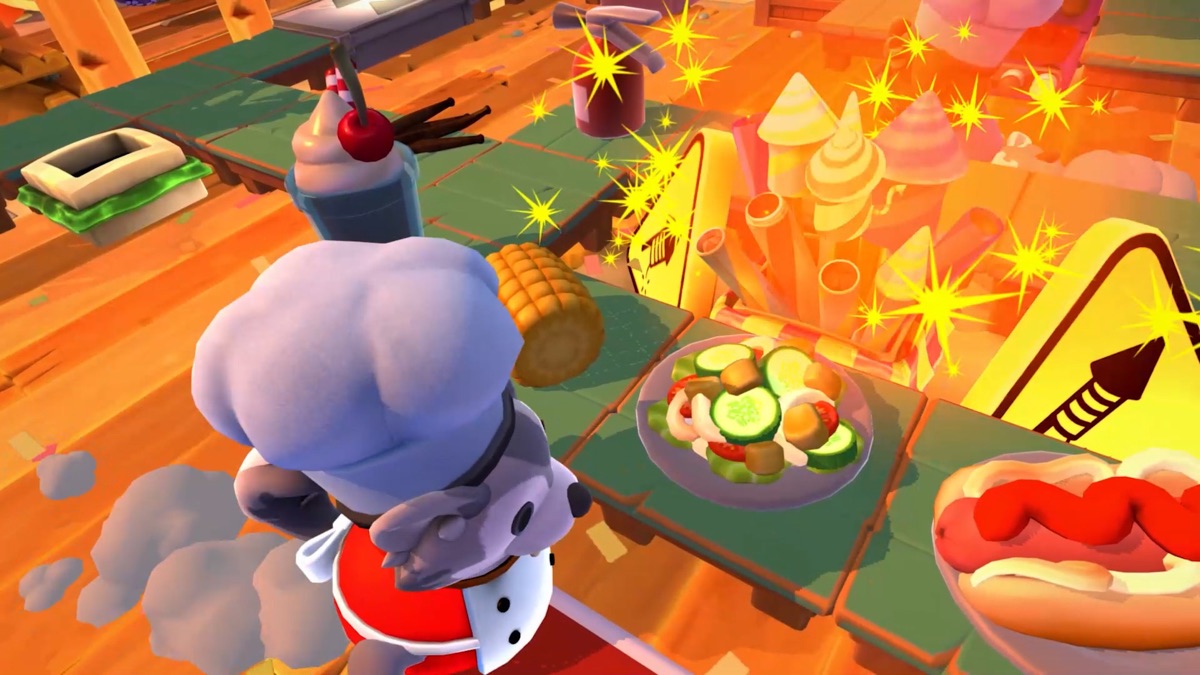 Chefs coordinate food preparation around kitchen hazards.