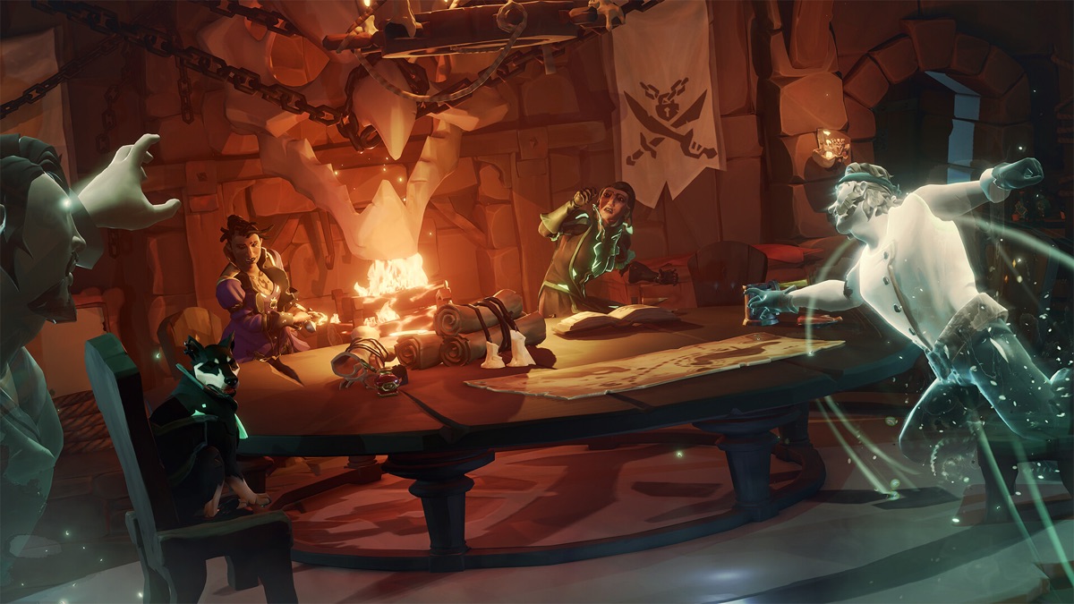 Pirates gather around a table inside a candlelit hideout.