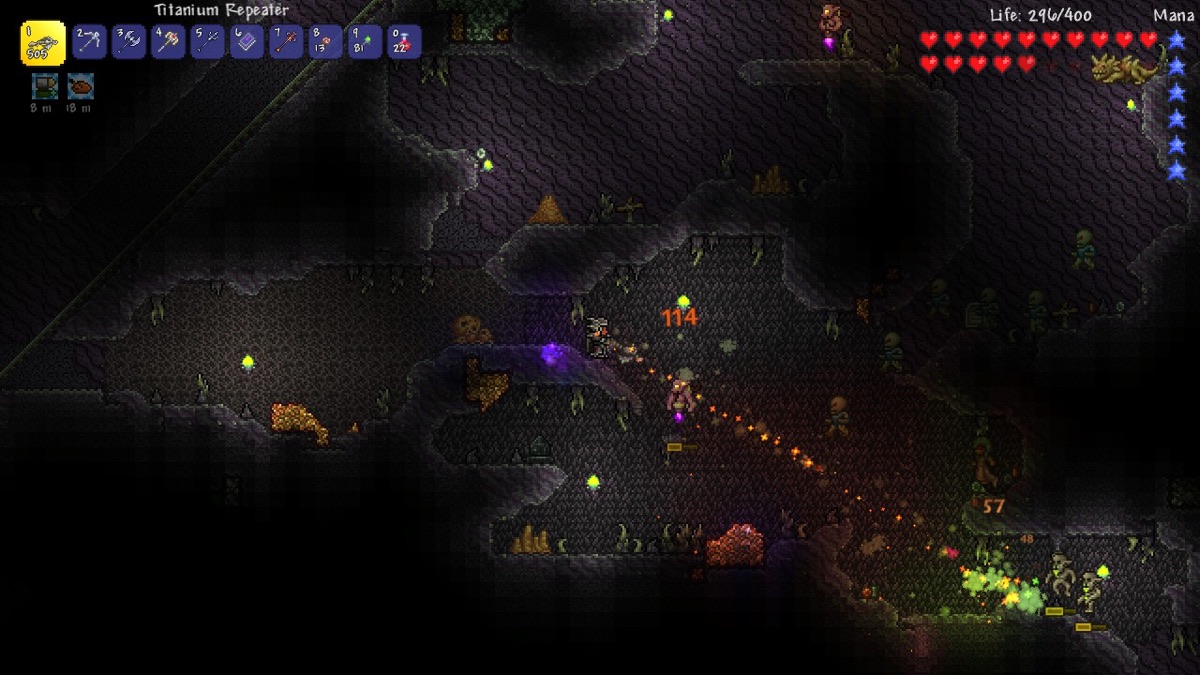 Several players fight creatures in a dark cavern.