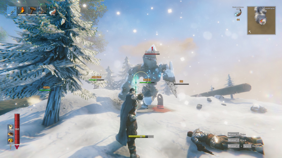 Players battle a large enemy in a snowy landscape.