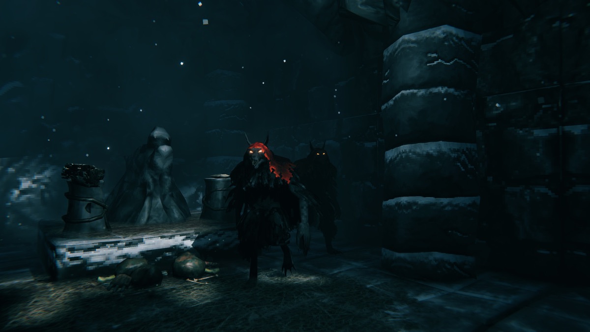 A group ventures through a dark stone dungeon.
